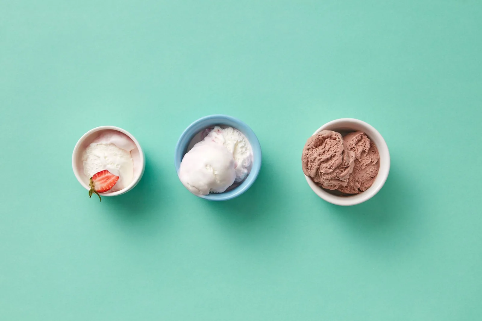 Three scoops of ice cream in small cups