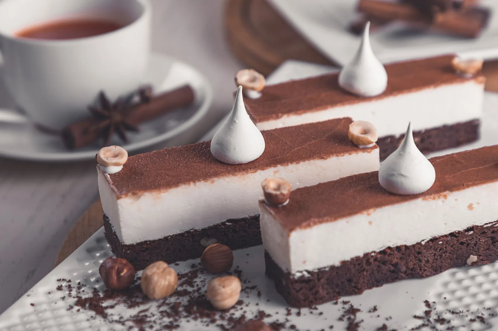 Chocolate mousse bars with meringue and whole hazelnuts